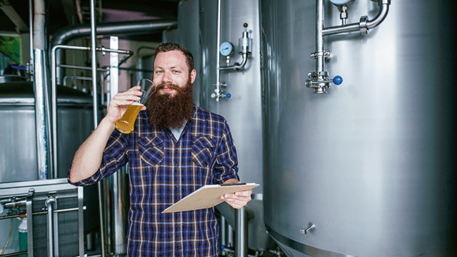 bearded man with a beer glass craft brewing 640x360