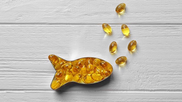 Capsules of cod liver oil arranged in a fish shape