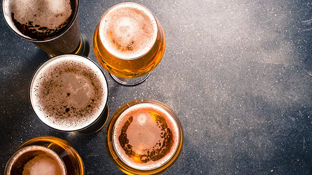 beer glasses on dark table smaller