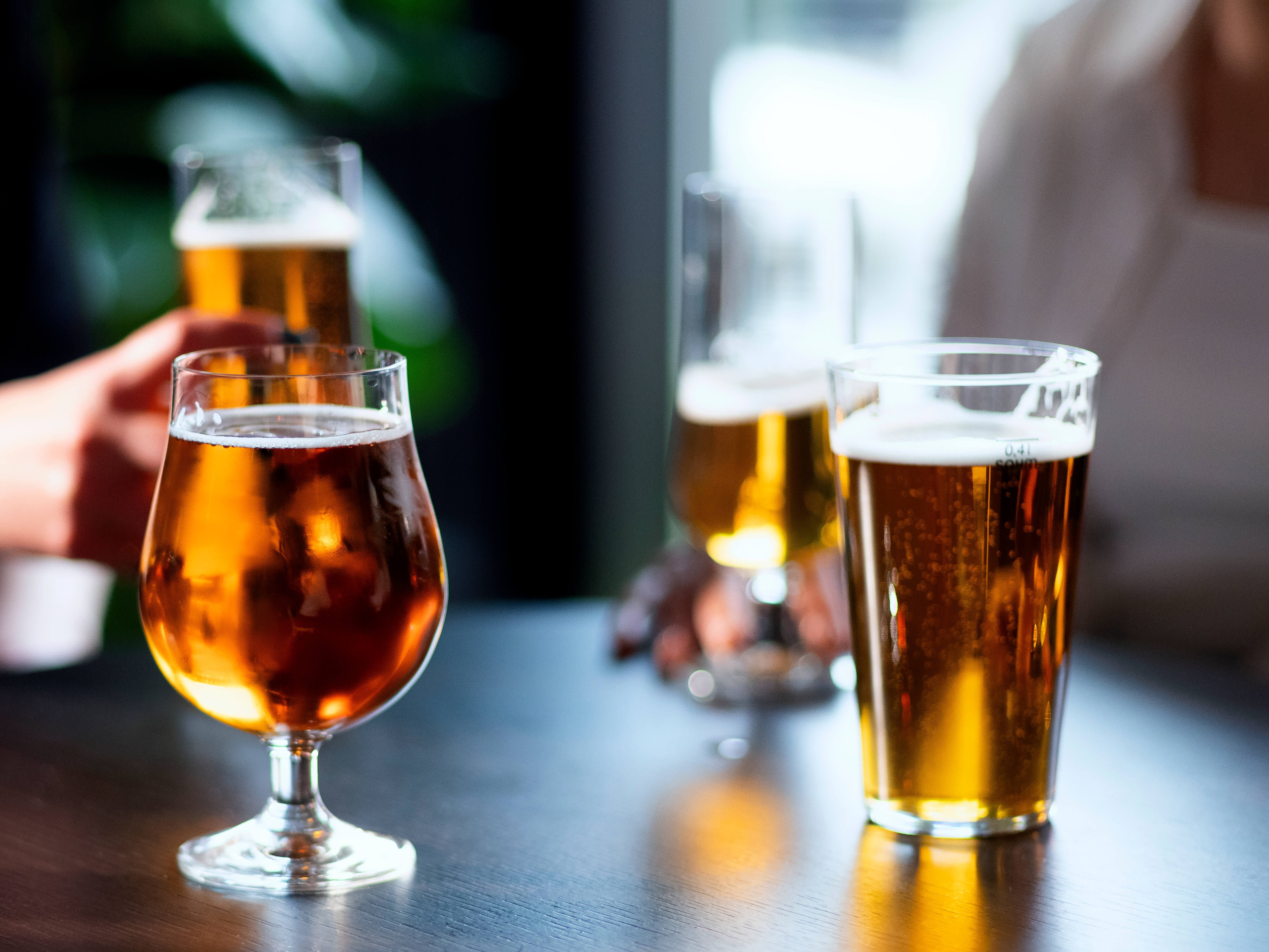 Beer glasses on dark table